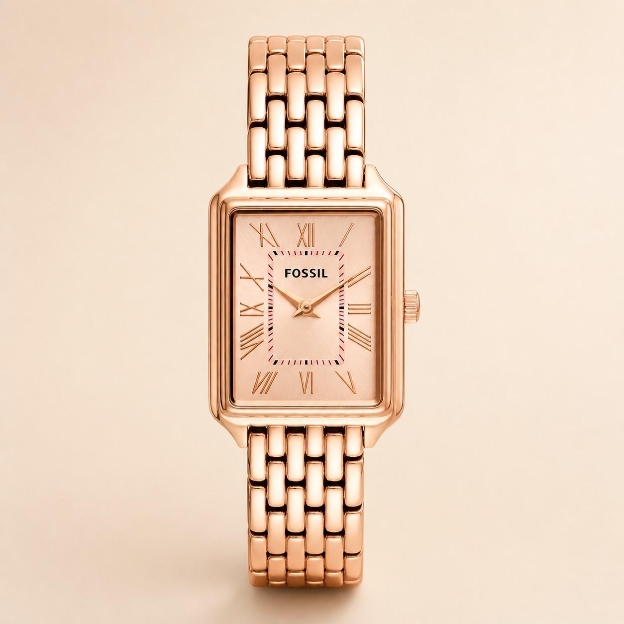 Rose gold Fossil watch on a beige background
