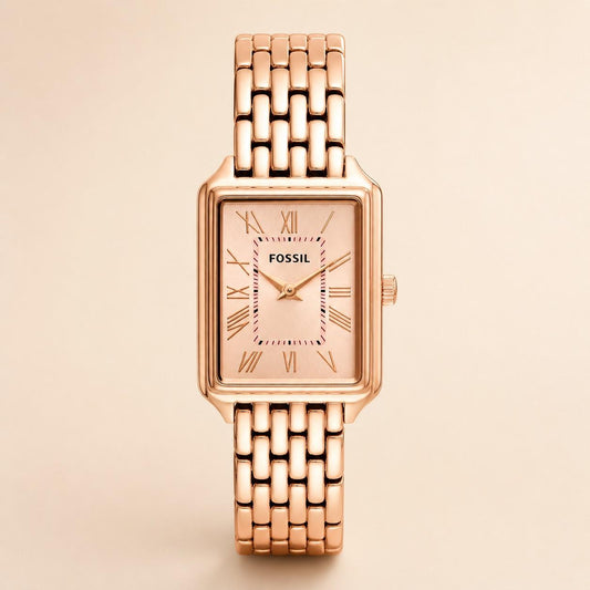 Rose gold Fossil watch on a beige background